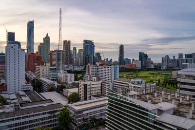 Bangkok, thailand - 10 august 2022 - aerial view of bangkok cityscape high-rises and bts skytrains