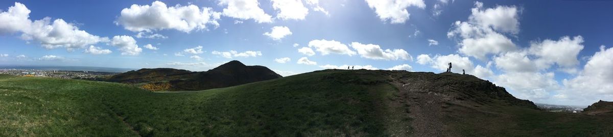 Panoramic view of land and mountains against sky