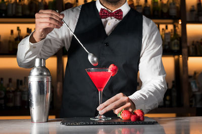Midsection of man holding ice cream