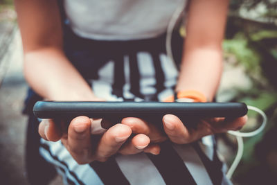 Close-up of person using mobile phone