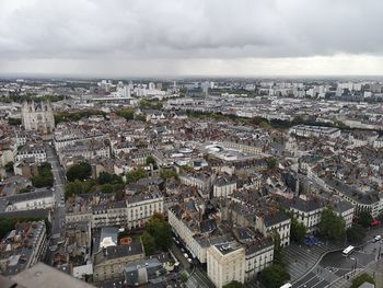 High angle view of city buildings against sky