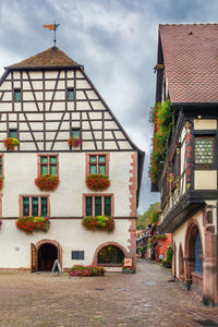 Street with historical half-timbered houses in kaysersberg, alsace, france