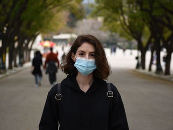 Portrait of a beautiful young woman wearing a mask during the quarantine in athens, greece 