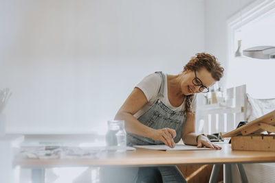 Artist painting in studio