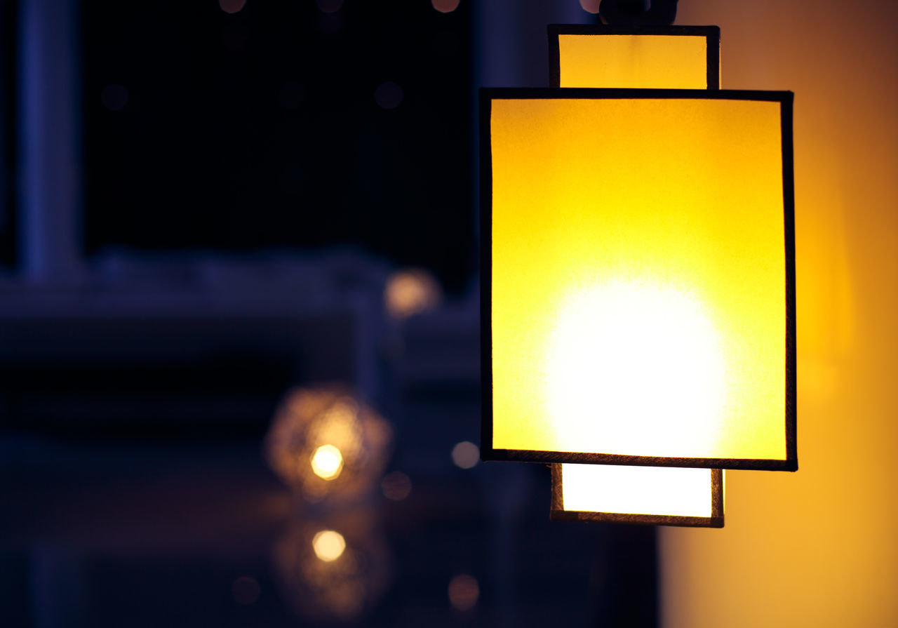 CLOSE-UP OF ILLUMINATED LIGHT BULB