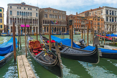 Boats moored in canal