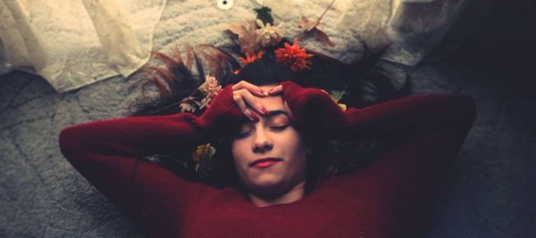 High angle portrait of young woman lying down