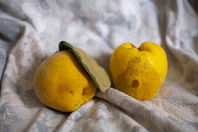 Close-up of yellow fruits on wood