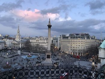 High angle view of buildings against cloudy sky