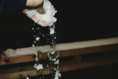 Close-up of hand by water