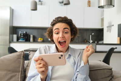 Young woman using mobile phone