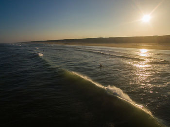Scenic view of sea against sky at sunset