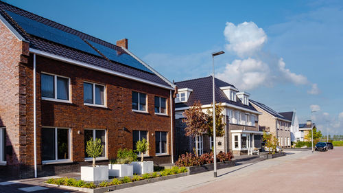 Buildings in city against sky