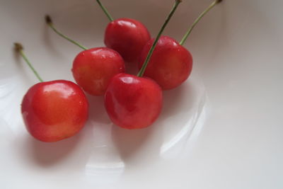 Close-up of cherries on table