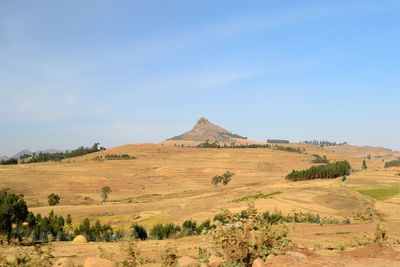 Scenic view of arid landscape against sky