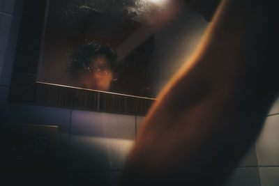 Man in front of the mirror after a bath