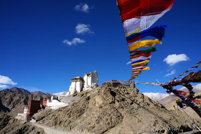 Low angle view of built structure against blue sky