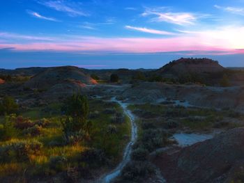 Scenic view of landscape against sky during sunset