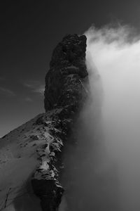 Rock formations on mountain against sky