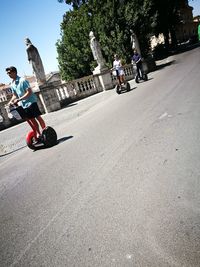 People riding motorcycle on road