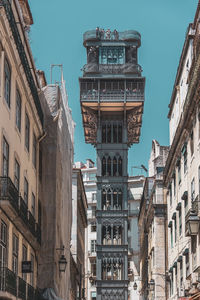 Low angle view of buildings against blue sky