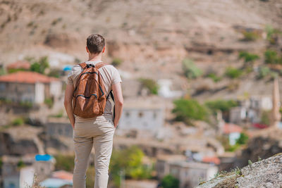 Rear view of couple walking on mountain