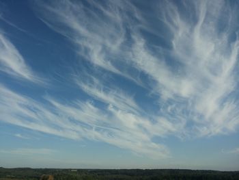 Scenic view of landscape against cloudy sky