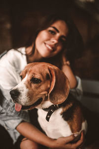 Portrait of dog and woman at home