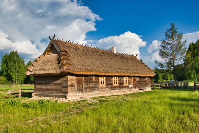 House on field against sky