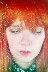 Close-up portrait of a girl in snow