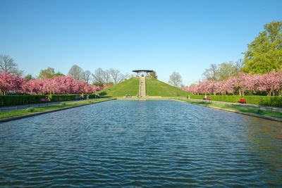 View of lake against blue sky