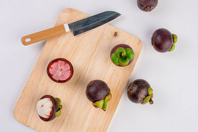 High angle view of fruits on cutting board