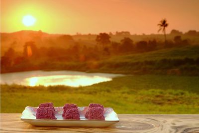 High angle view of dessert on table against sky during sunset