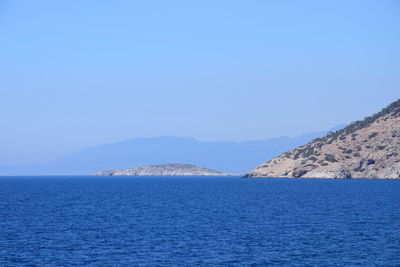 Scenic view of sea against clear blue sky