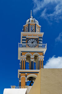 Low angle view of clock tower against sky