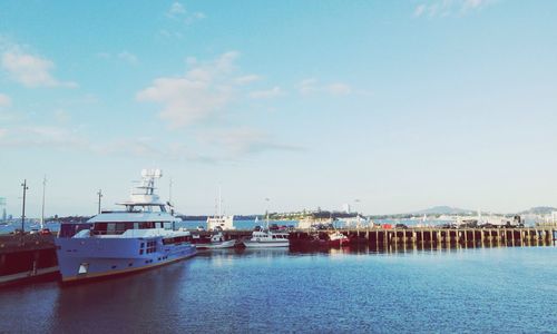 Boats moored at harbor