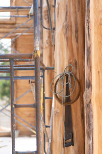 Close-up of metal fence against building