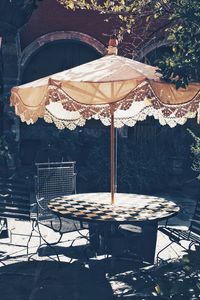 Chairs and tables against building