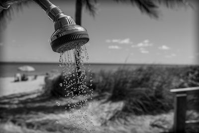 Close-up of splashing water against sky