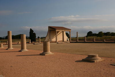 Built structure on beach against sky