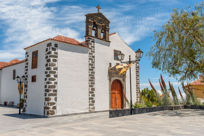 Exterior of bell tower against sky