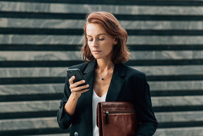 Young woman using mobile phone