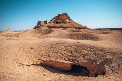 Scenic view of desert against clear sky