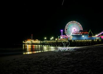 Ferris wheel by santa monica pier at night