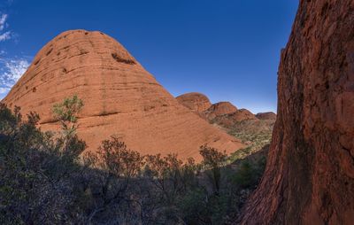 Scenic view of mountains against clear blue sky