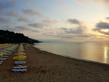 Scenic view of beach against sky during sunset