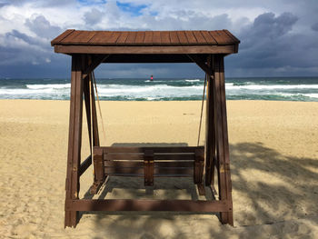 Tea for two on a swing bench - on the beach.