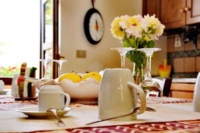 Flower vase on table at home