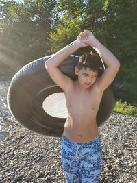 Portrait of happy boy standing on land