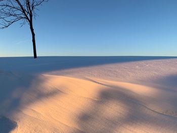 Scenic view of desert against clear sky